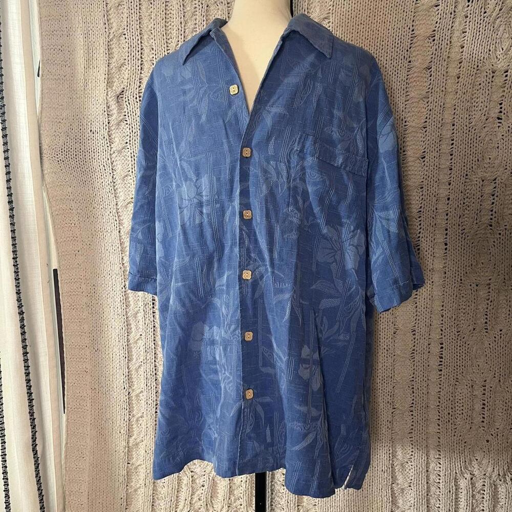 Jamaica Jaxx blue Hawaiian shirt with tropical leaf pattern.